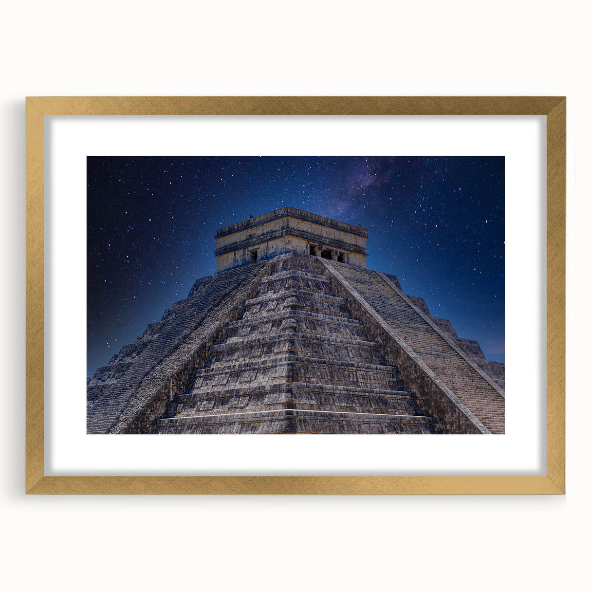 Extra large abstract art print of Central American scenery in gold frame, featuring textured earth tones.