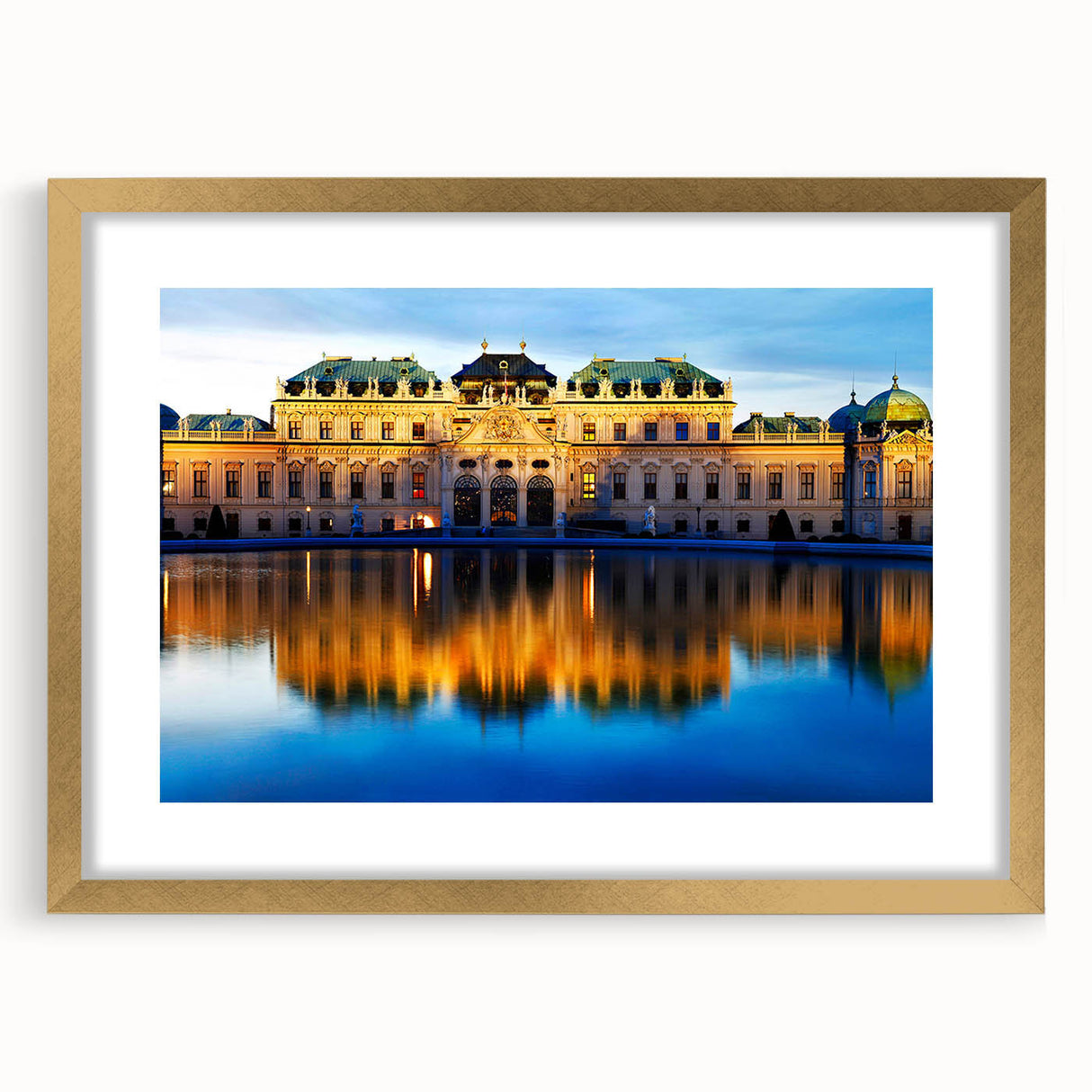 Abstract art print of a European landscape in muted gold and green tones, framed with a gold mat.