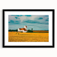 Abstract art print featuring colorful, textured imagery of a European scenery in a black frame, ideal for living room decor.