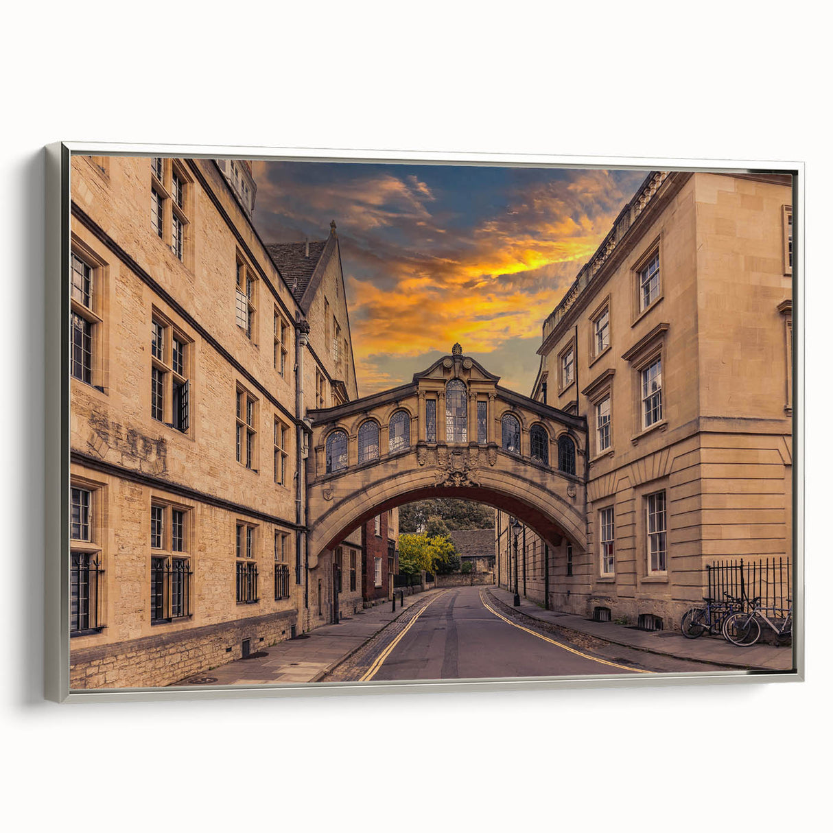 Framed canvas of a vintage Oxford landscape painting, featuring muted tones with black accents, suitable for office decor.