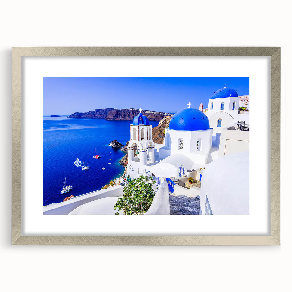 Extra large wall art of Santorini with textured abstract prints in vibrant blue and white, framed in silver.