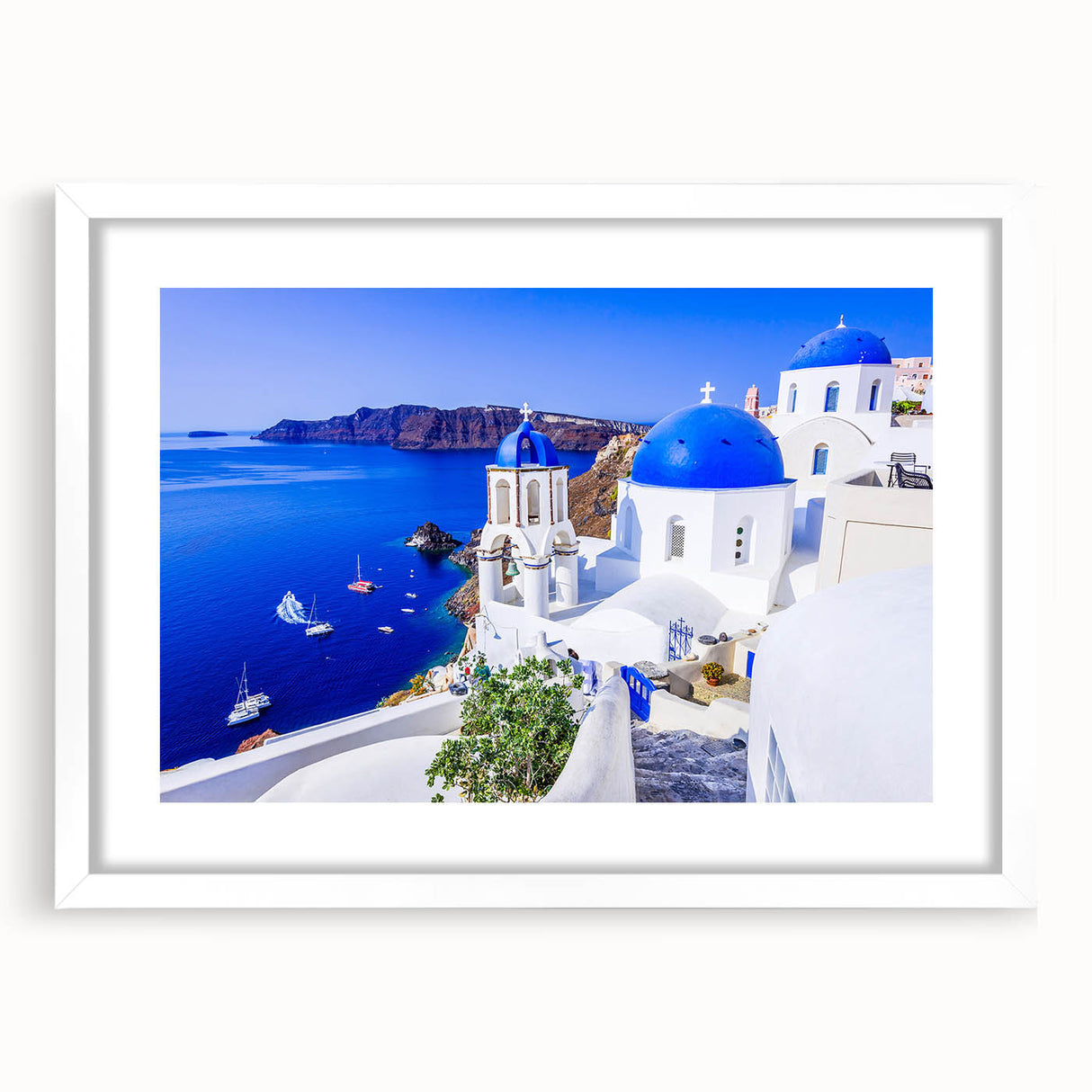 Textured art print of Santorini with abstract white buildings and vibrant blue skies, framed with a white mat.