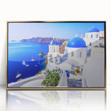 Acrylic print of Santorini scenery with white buildings and blue sea, in a gold frame, suitable for modern art wall decor.