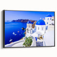 Black and white wall art featuring a vintage poster art style landscape of Santorini on framed canvas.
