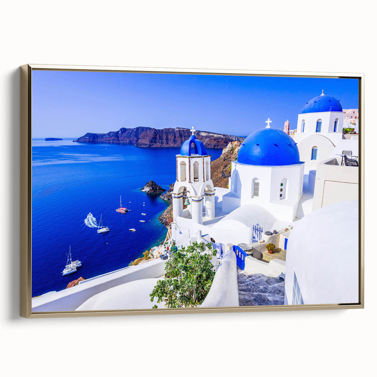 Framed canvas of Santorini landscape in muted blues and whites, ideal for bedroom wall art.
