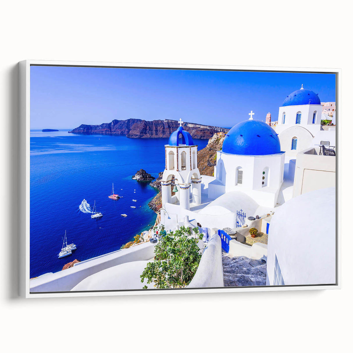 Framed canvas of vintage poster art depicting Santorini, Greece, in colorful tones, ideal for living room decor.