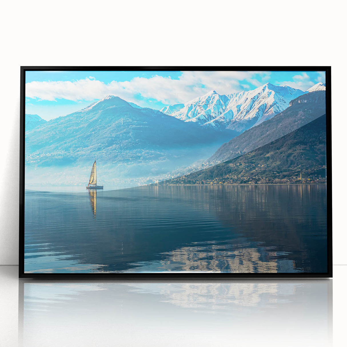Large abstract wall art of Lake Como with muted blue and green hues, framed in black acrylic.