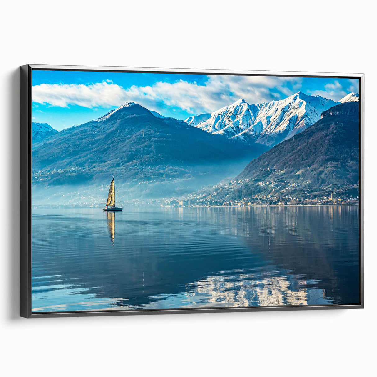 Black and white wall art featuring a vintage poster style landscape of Lake Como on a framed canvas.