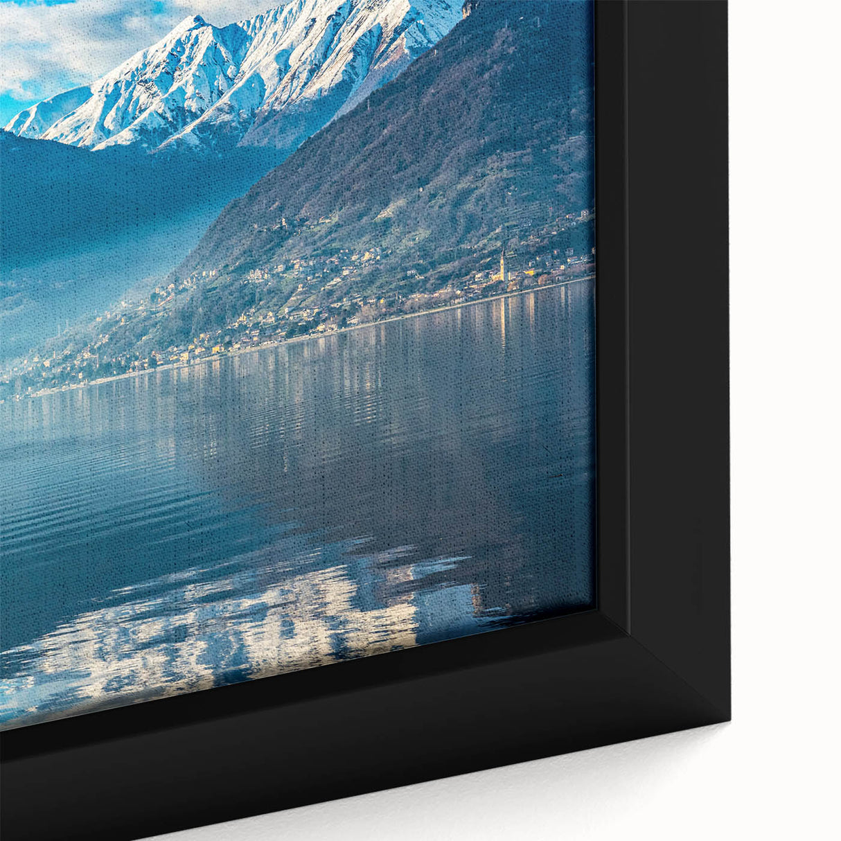 Extra large framed canvas of Lake Como with textured black edges and colorful scenery, ideal for living room decor.