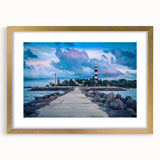 Abstract art print of a European landscape in muted gold and green tones, framed with a golden mat.