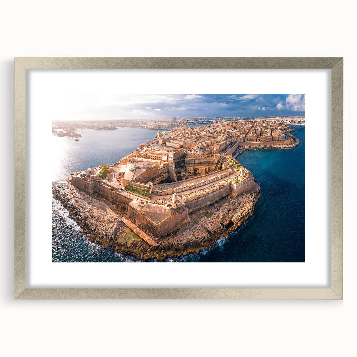 Textured abstract art print of a European Malta scenery in muted earth tones, framed in silver, ideal for living room decor.