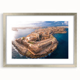 Textured abstract art print of a European Malta scenery in muted earth tones, framed in silver, ideal for living room decor.
