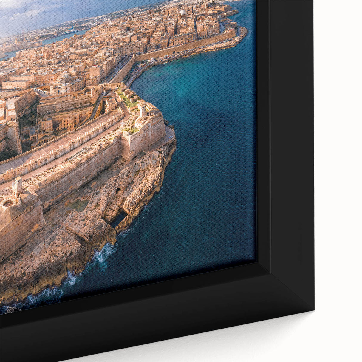 Black wall art featuring a textured view of Malta with vibrant colors on a framed canvas, suitable for a large living room.