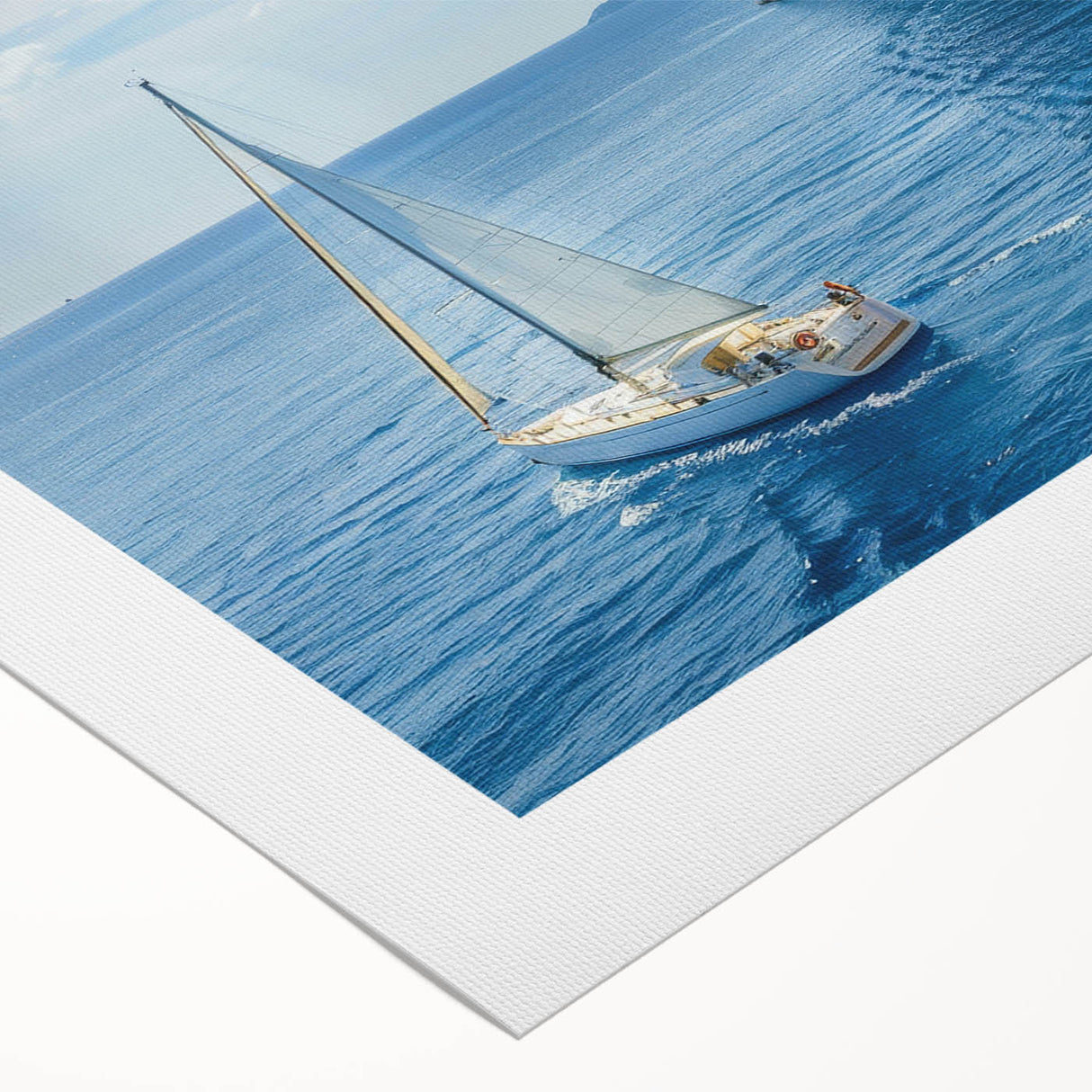 Art deco poster of the Mediterranean Sea, featuring soft blue and white tones, on rolled canvas.