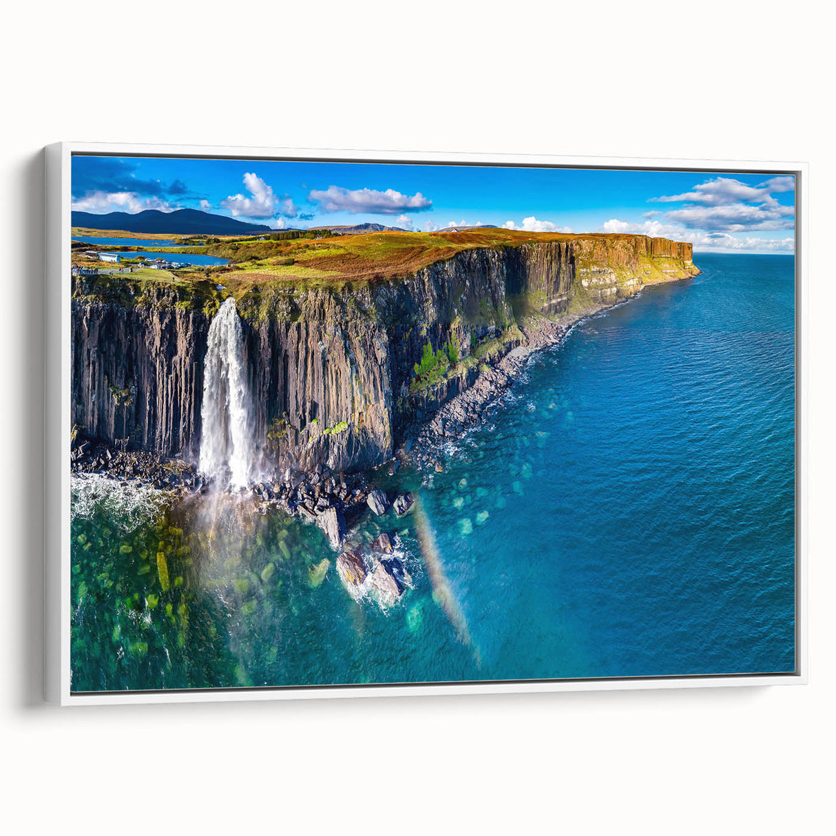 Vintage poster art of a Scottish landscape on a framed canvas, featuring vibrant green and blue tones.