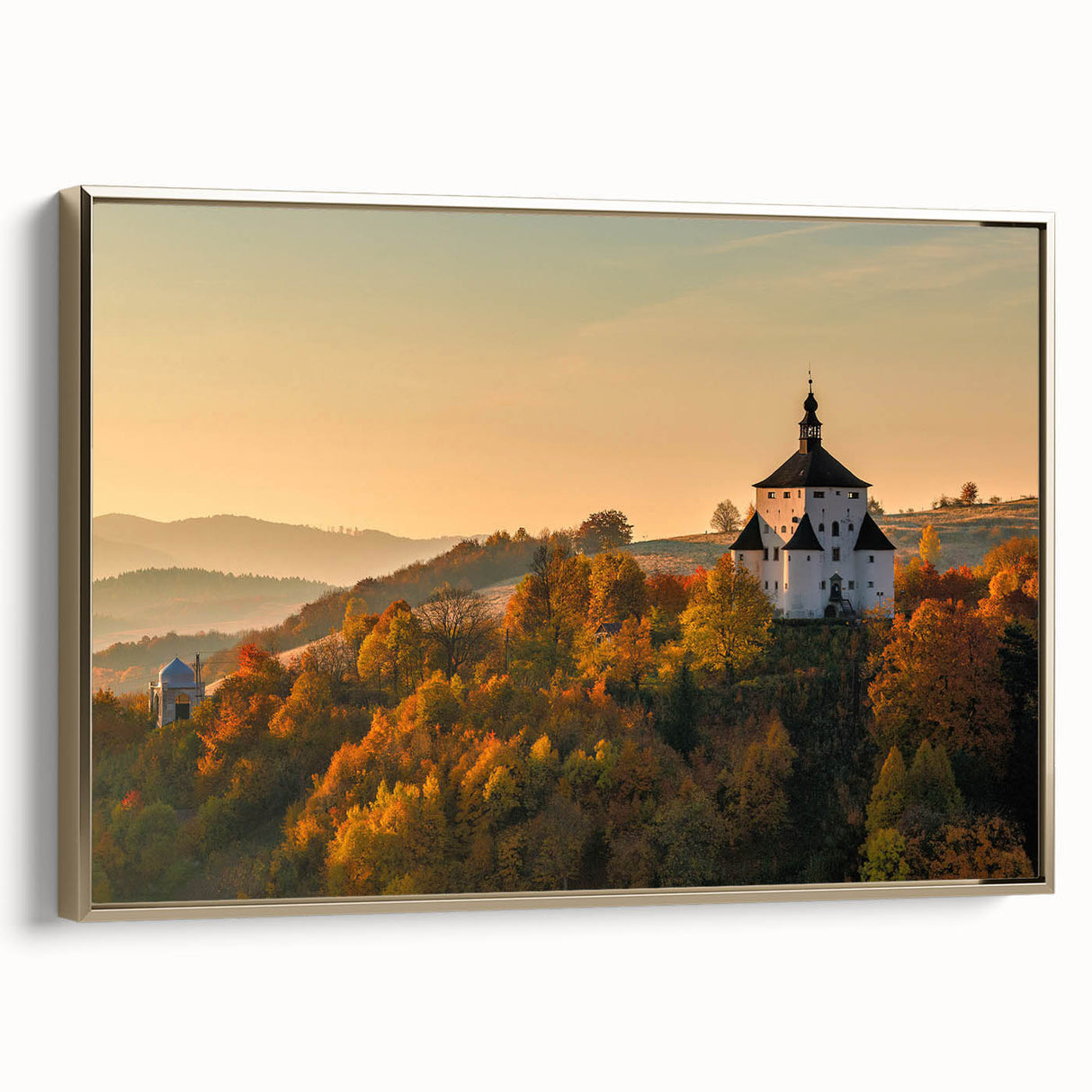 Framed canvas featuring a vintage-style landscape painting of a Slovakian scenery in black and gold tones.