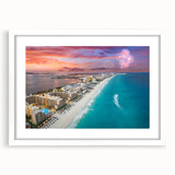 Abstract art print of Cancun scenery in muted blue and green tones on a framed white mat, ideal for dining room decor.