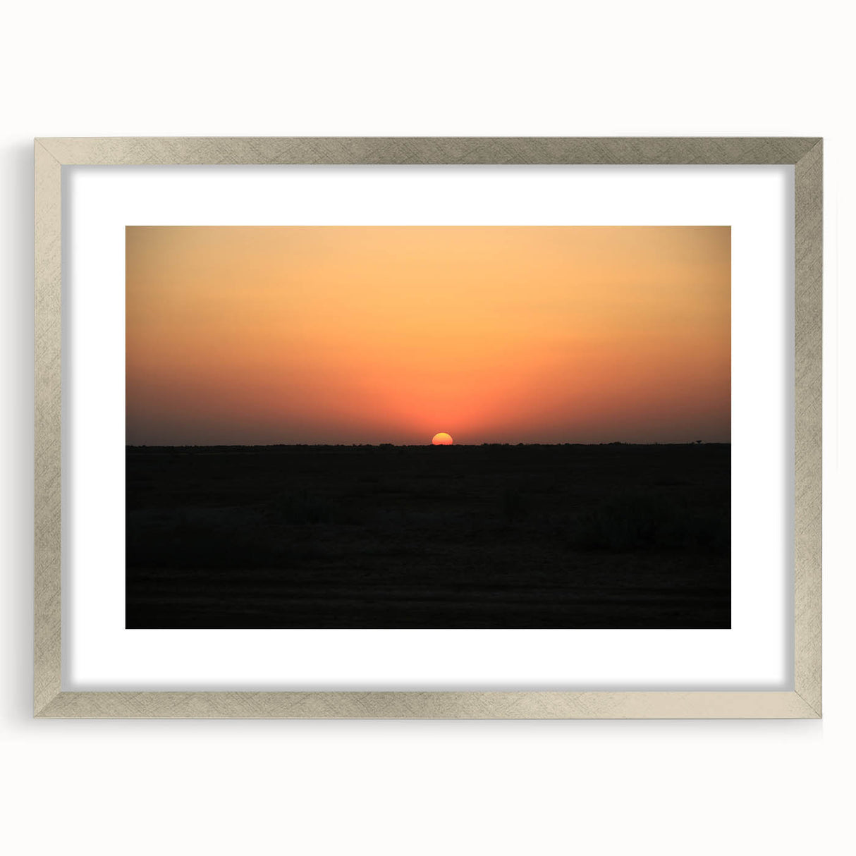 Textured abstract art print depicting a Middle Eastern scenery in muted earth tones, framed with a silver mat.
