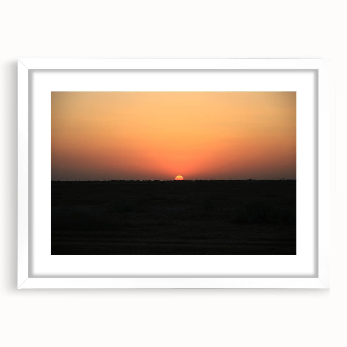 Abstract art print of a Middle Eastern landscape in muted earth tones on a framed white mat, ideal for dining room decor.