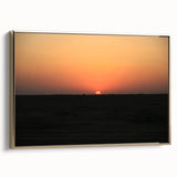 Framed canvas featuring a vintage-style landscape painting of a Middle Eastern scene in muted gold and black tones.