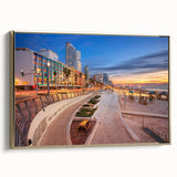 Framed canvas wall art featuring a vintage-style landscape painting of Tel Aviv in black and gold tones.