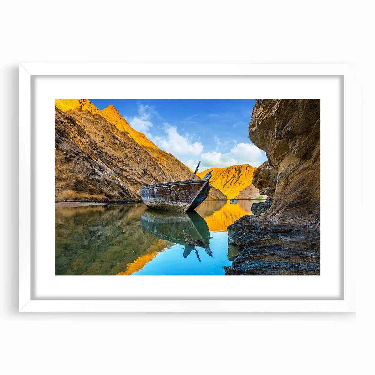 Abstract art print of Middle Eastern scenery in muted earth tones, framed with a white mat, ideal for dining room decor.