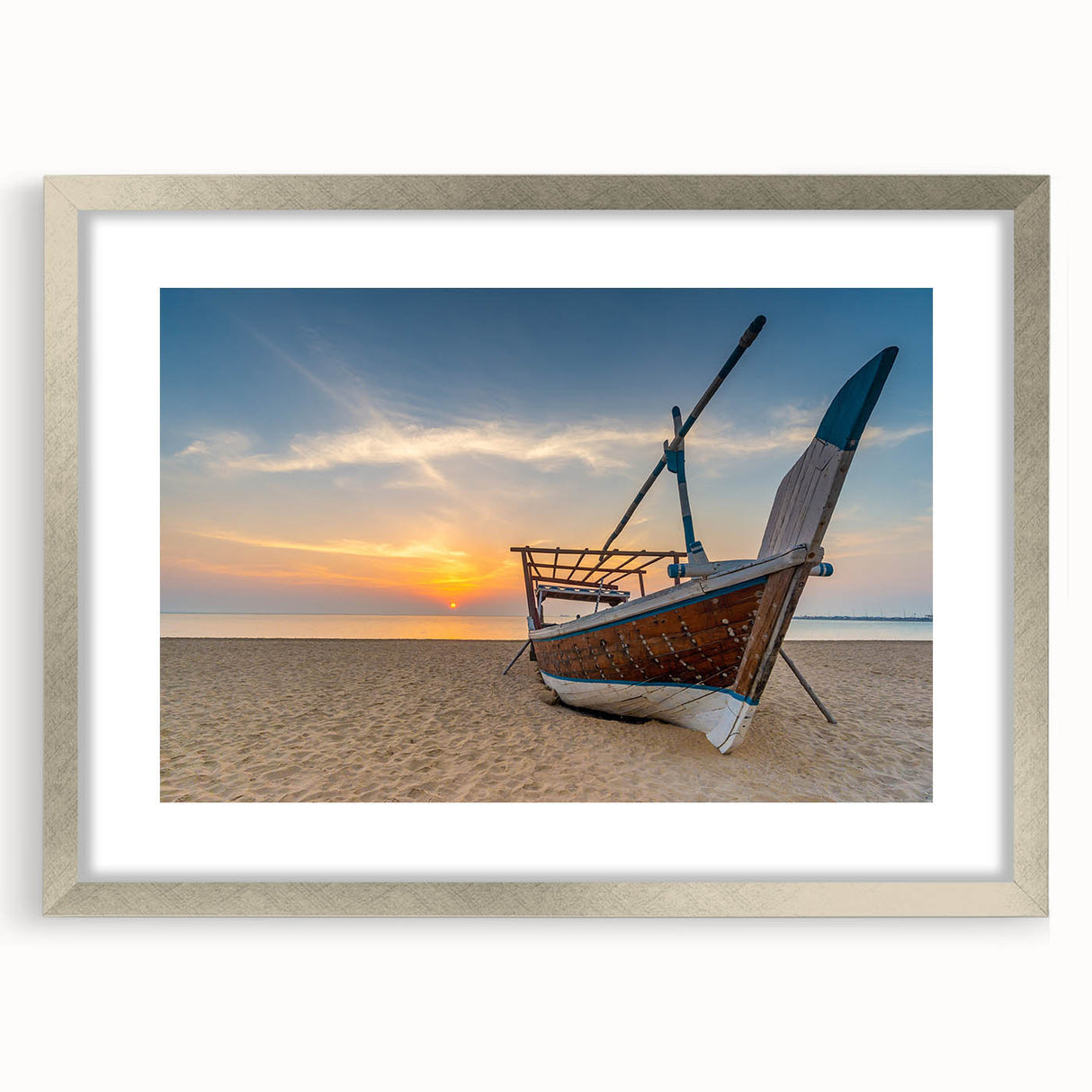 Textured abstract art print of a Middle Eastern scenery in muted earth tones, framed with a silver mat.