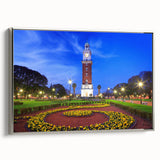 Framed canvas of a vintage-style landscape painting depicting Buenos Aires, with colorful art elements and a black border.