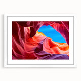 Abstract art print of Antelope Canyon in Arizona, with vibrant orange and red tones on a white framed canvas.