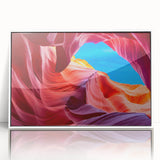 Art deco poster of Antelope Canyon in Arizona, featuring earthy red and orange tones on a white framed acrylic print.