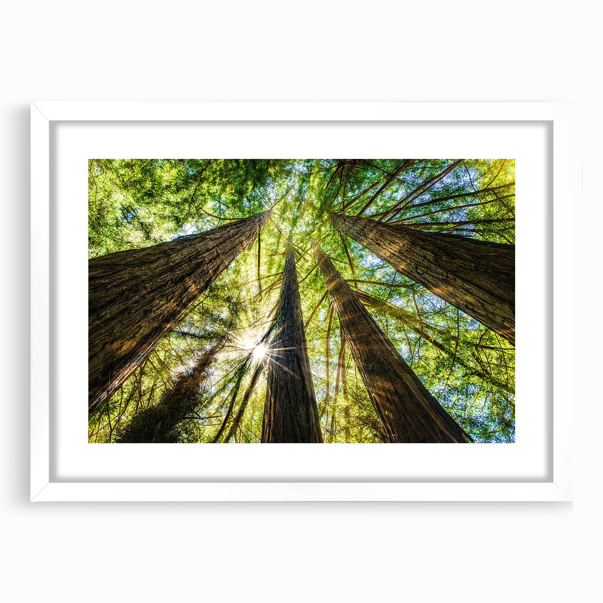 Abstract art print of California's Big Sur in muted blue and green tones, framed with a white mat.
