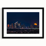 Extra large abstract art print of Los Angeles skyline in vibrant colors on a textured canvas, framed in black.