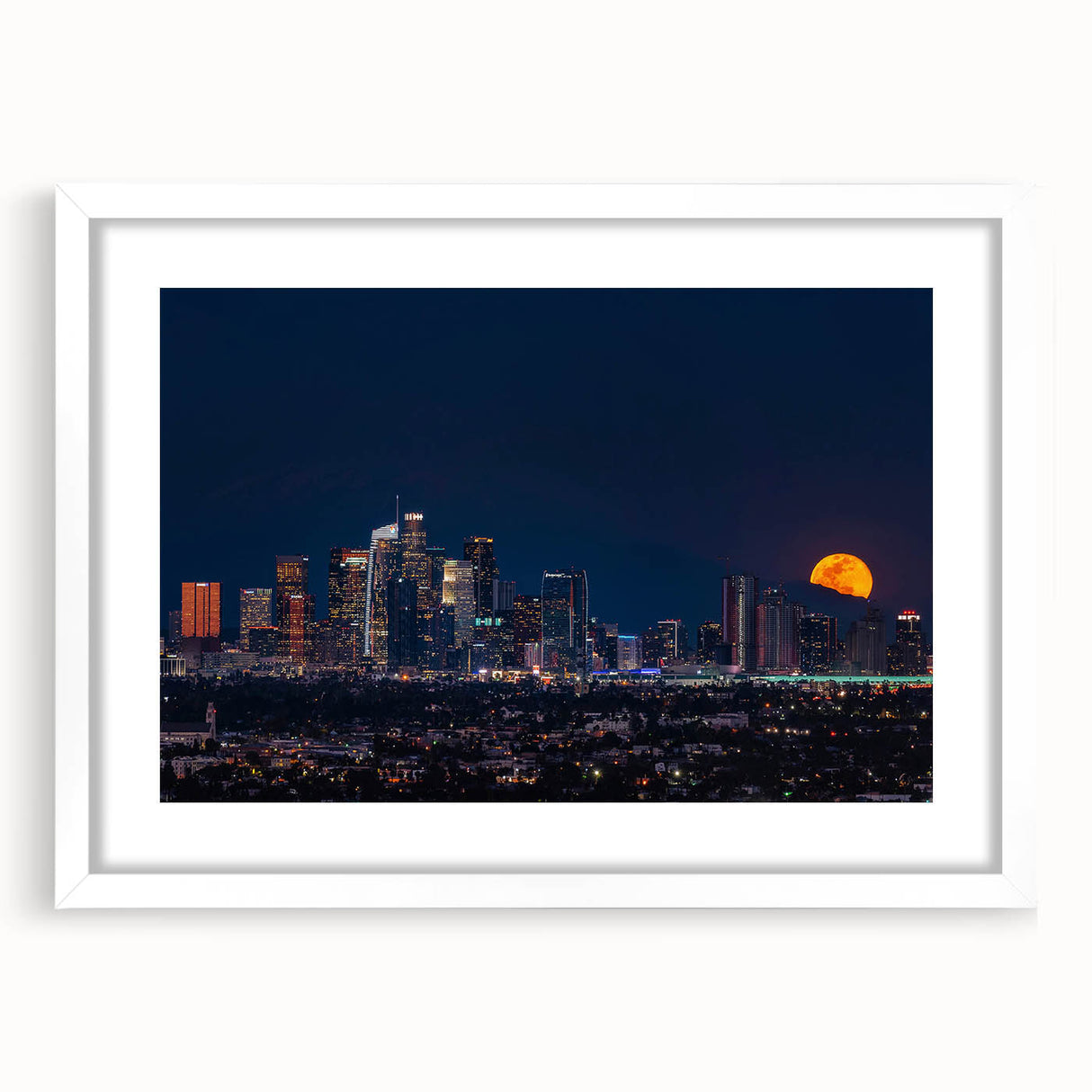 Abstract art print of Los Angeles skyline in muted gray and blue tones on a framed white mat, ideal for dining room decor.