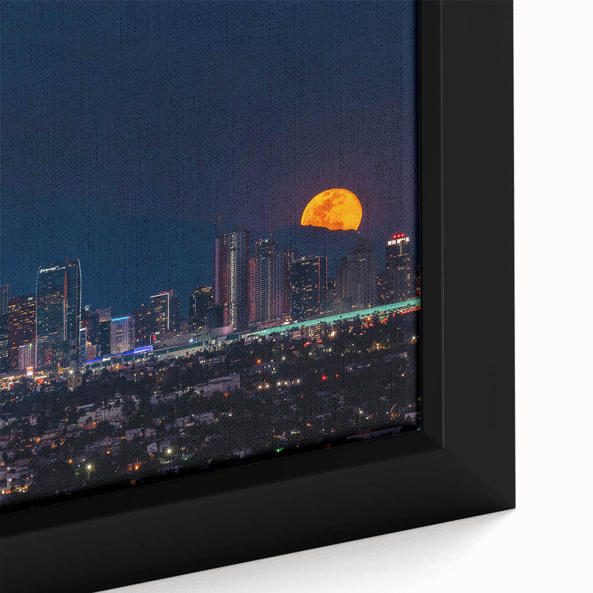 Framed canvas featuring a textured depiction of the Los Angeles skyline in black with vibrant, colorful accents.