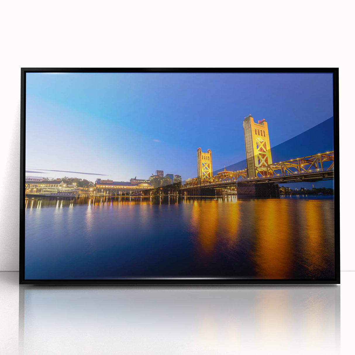 Large abstract wall art of Sacramento's skyline in muted grays and blues, framed in black acrylic.