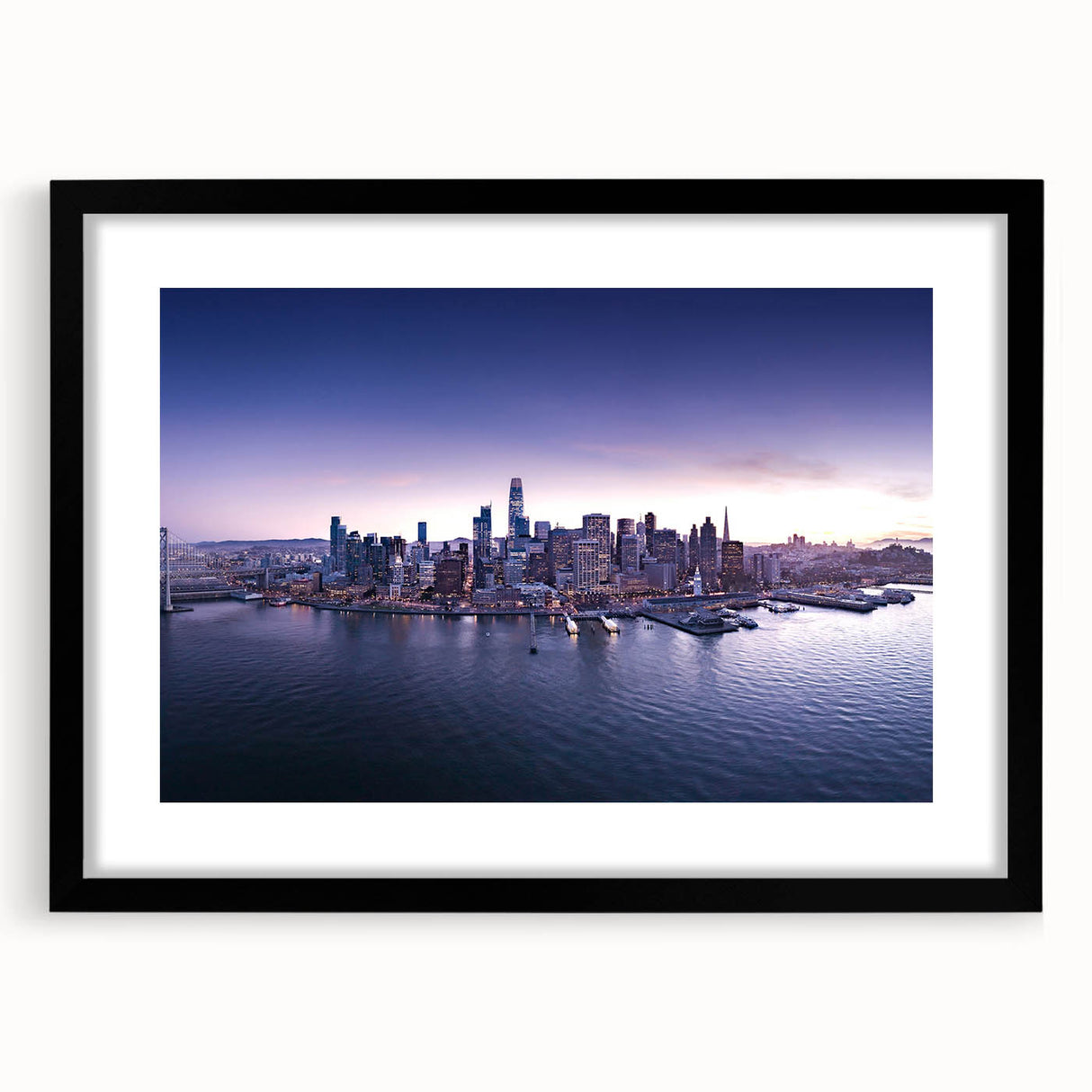 Colorful abstract art print of San Francisco skyline, featuring vibrant hues on a large framed canvas.
