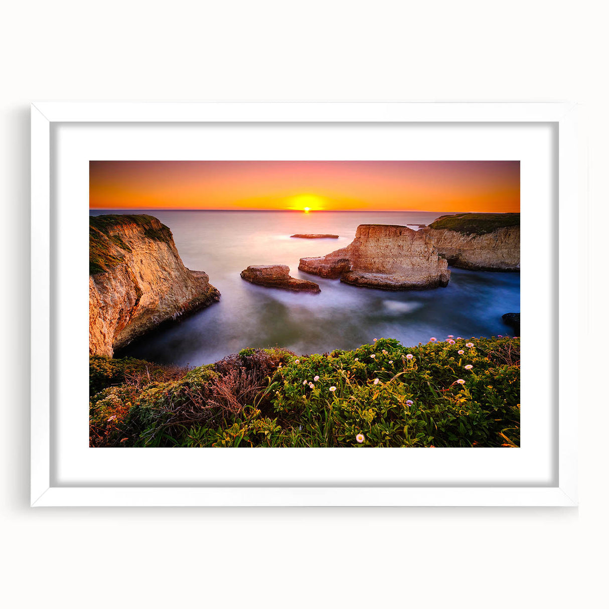 Abstract art print of Santa Cruz scenery in muted blue and green tones on a framed white mat, suitable for dining room decor.