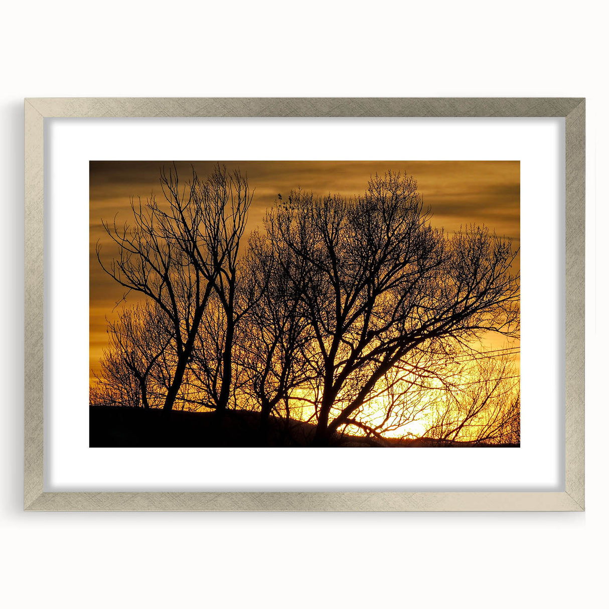 Textured art print of abstract Colorado Vail scenery in muted earth tones, framed in silver, suitable for bedroom decor.