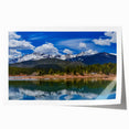 Rolled print of Colorado Springs scenery with soft floral accents in earthy tones.