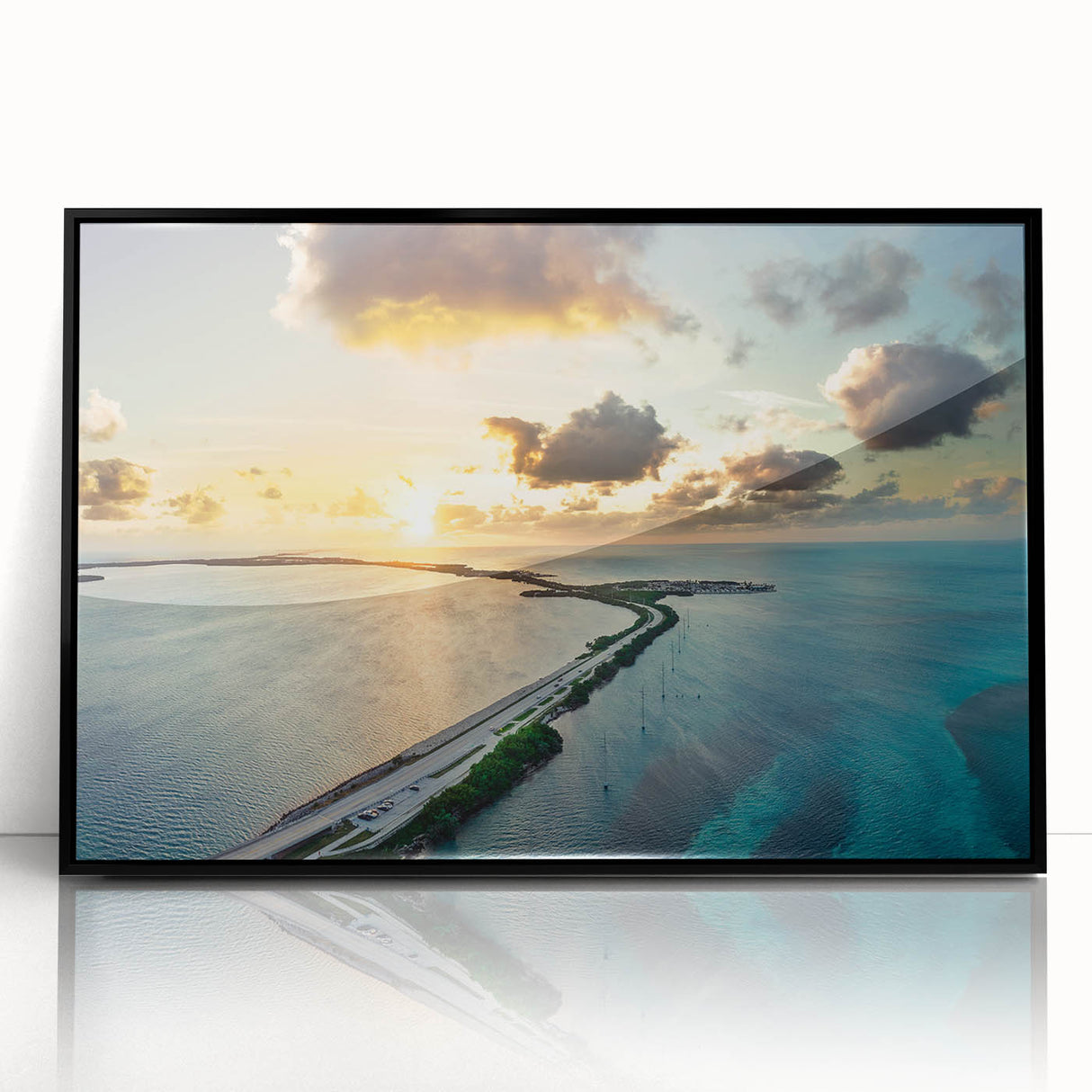 Large abstract wall art depicting the Florida Keys in vibrant blues and greens on a framed acrylic.