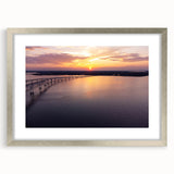Textured abstract art print of Annapolis scenery in muted blue and silver tones, framed with a silver mat.