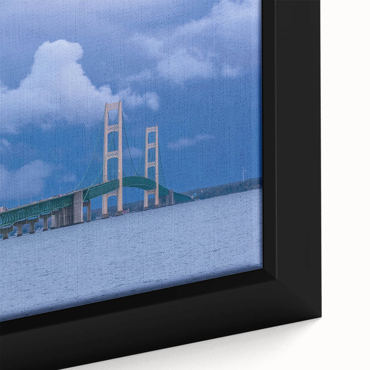 Close-up of a framed canvas depicting a textured Michigan Upper Peninsula scenery in black with colorful accents.