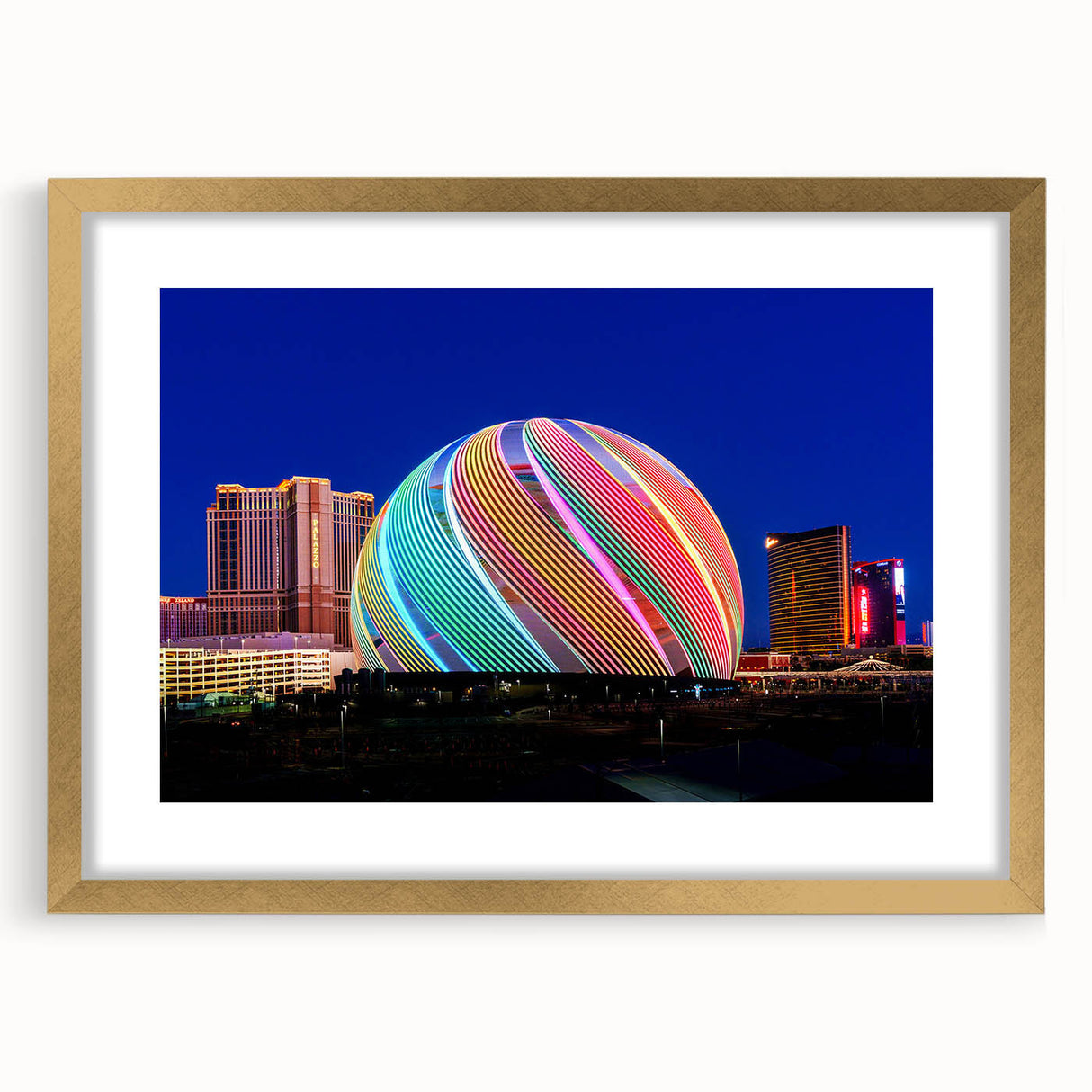 Extra large abstract art print of Las Vegas scenery in gold frame, featuring textured details and vibrant colors.