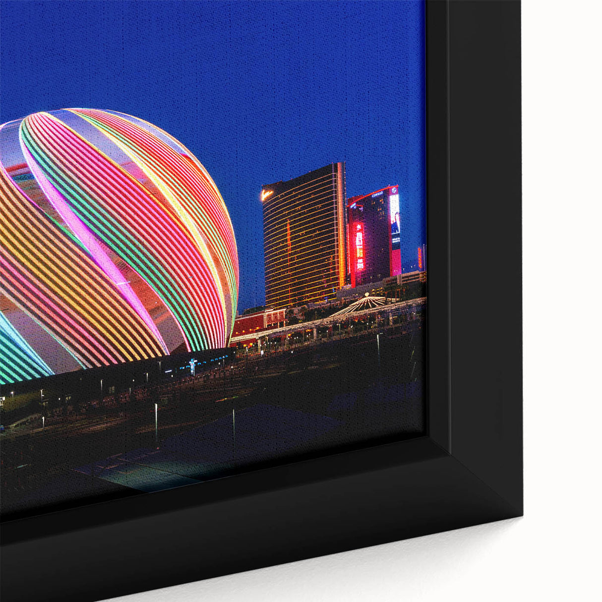 Close-up of extra large framed canvas featuring a textured depiction of the Las Vegas skyline in vibrant colors on a black…