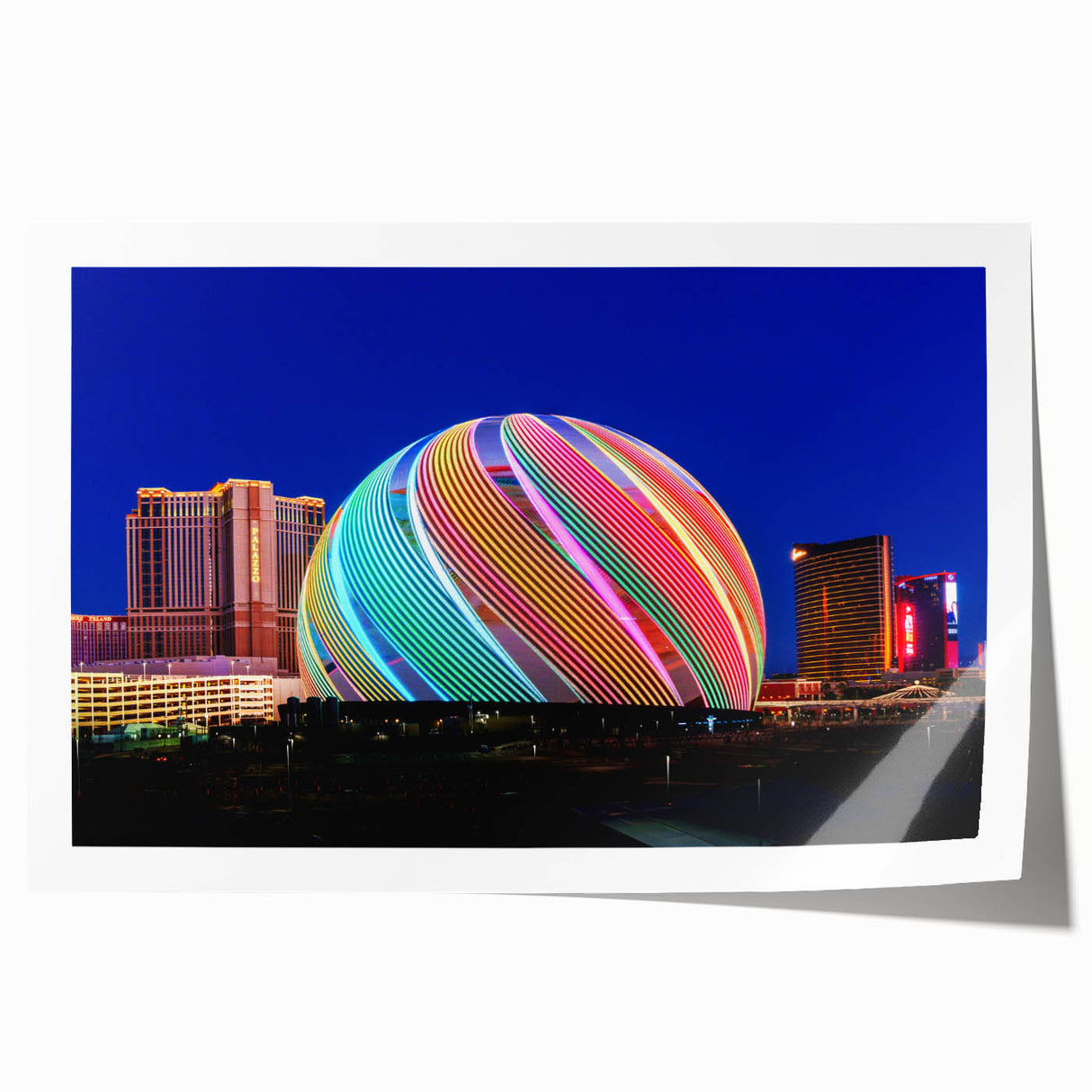 Extra large wall art of Las Vegas skyline in vibrant twilight hues on rolled canvas, ideal for dining room ambiance.