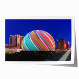 Extra large wall art of Las Vegas skyline in vibrant twilight hues on rolled canvas, ideal for dining room ambiance.