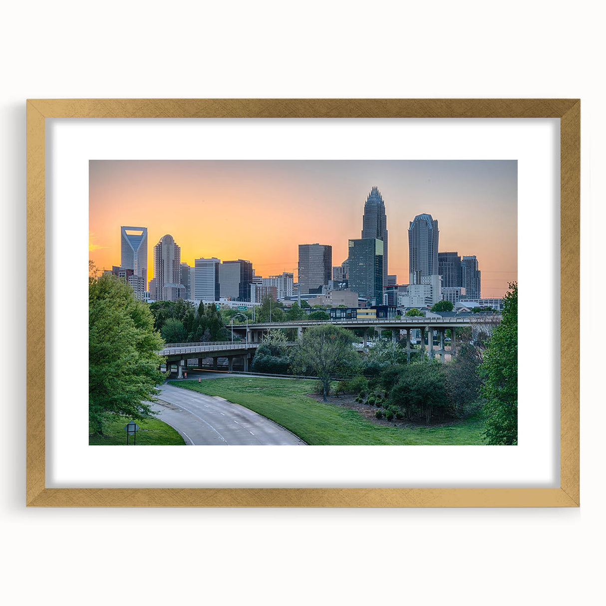 Abstract art print of Charlotte skyline in textured gold frame, ideal for extra large wall art in living rooms.