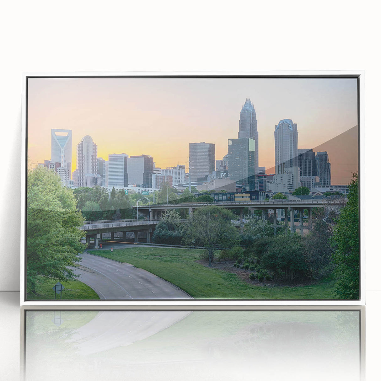 Acrylic print of Charlotte, North Carolina skyline in art deco style with muted gray and blue tones.