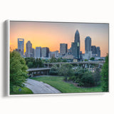 Vintage poster art of Charlotte, North Carolina skyline in vibrant colors on a large framed canvas.