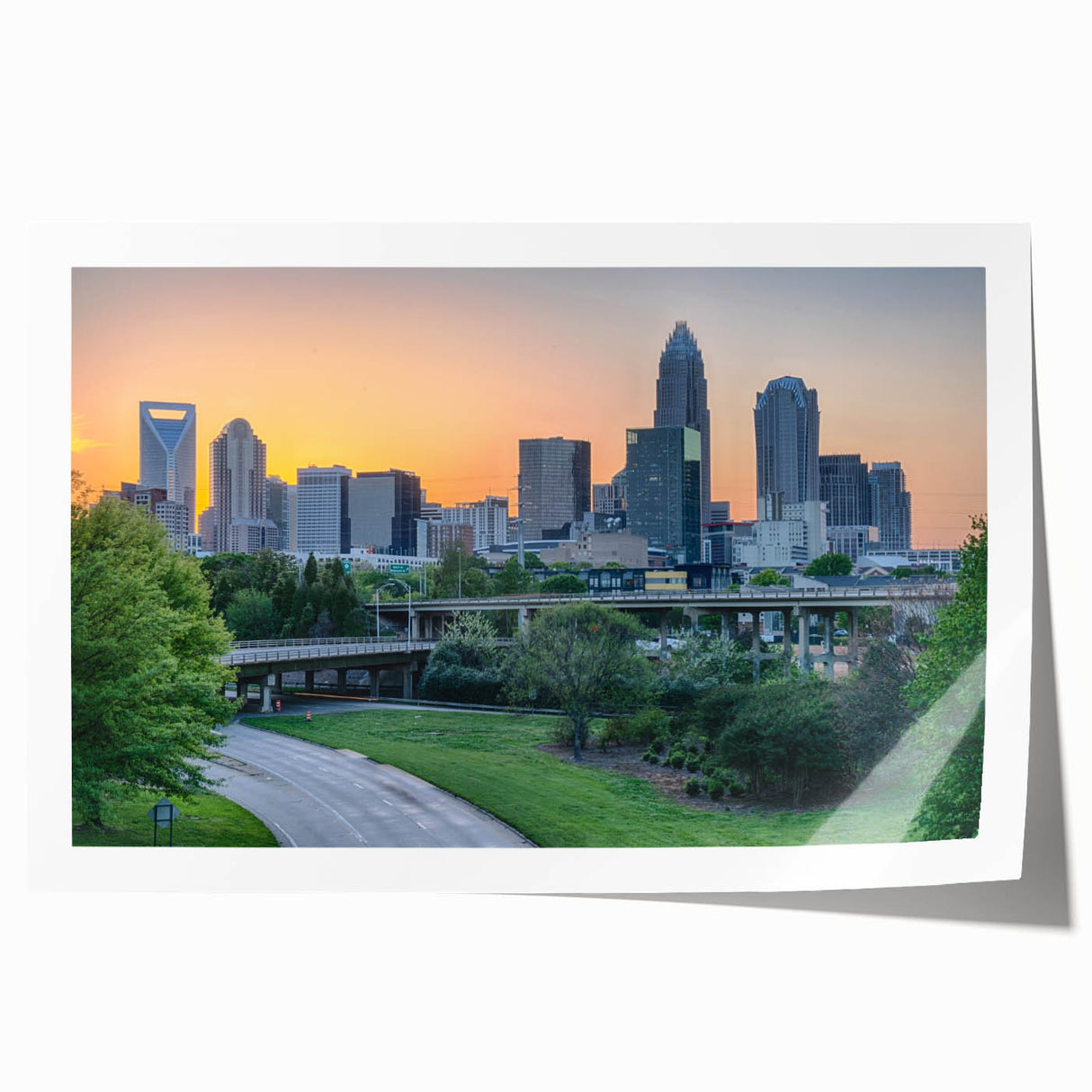 Rolled print of Charlotte, North Carolina skyline in muted gray and blue tones, suitable for art wall dining room.